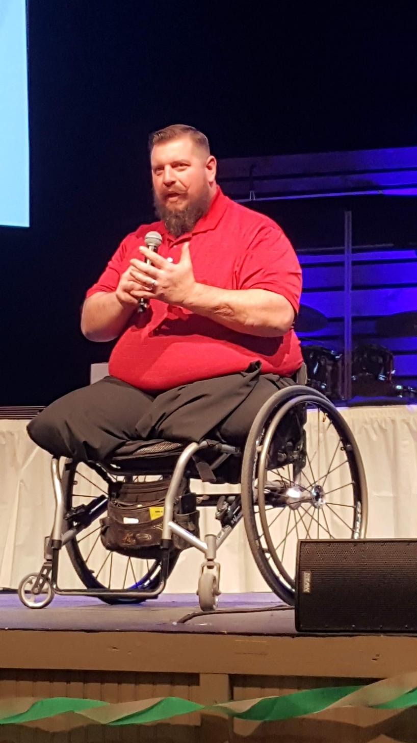 Jay Baker speaking with microphone